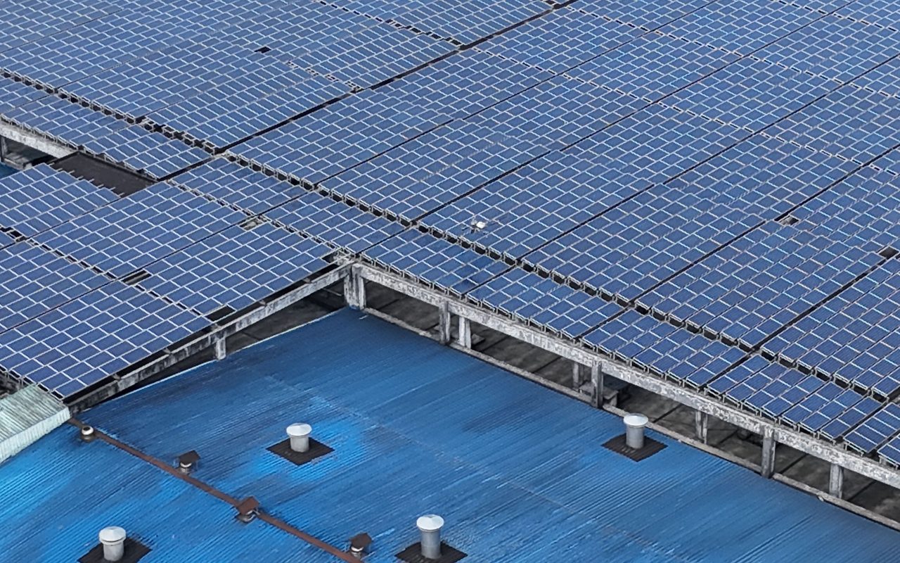 Dense rooftop solar panel array seen from above