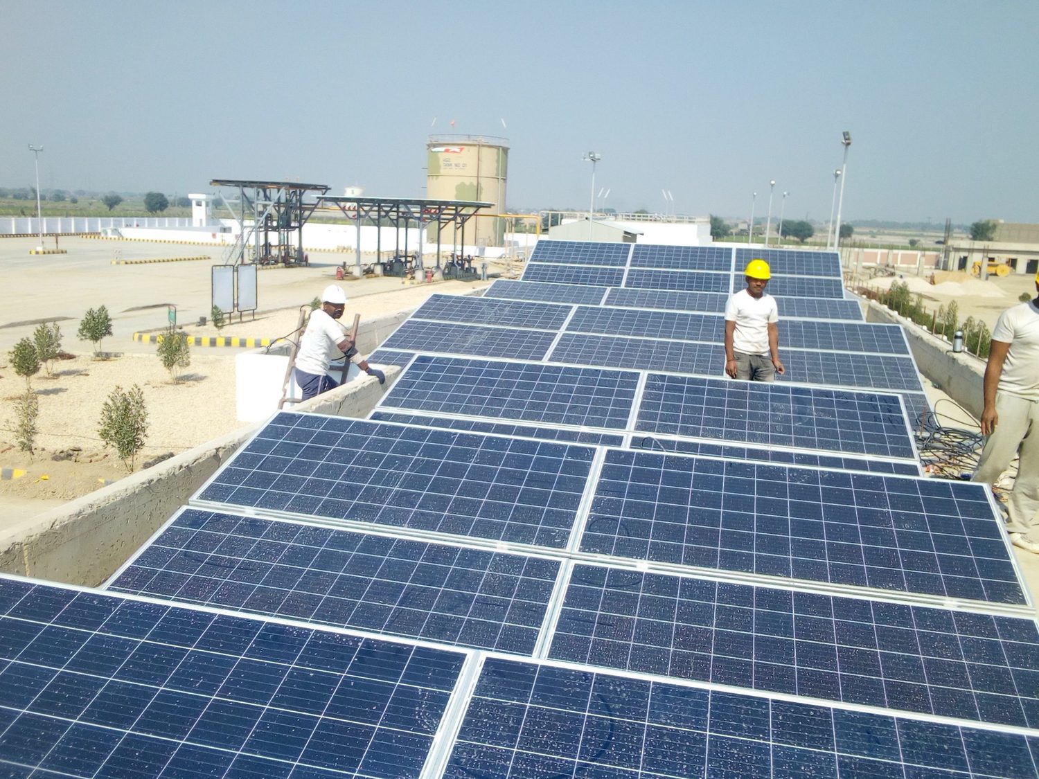 S3 installation crew mounting solar panels on a commercial rooftop